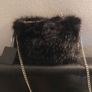Faux fur clutch bag.